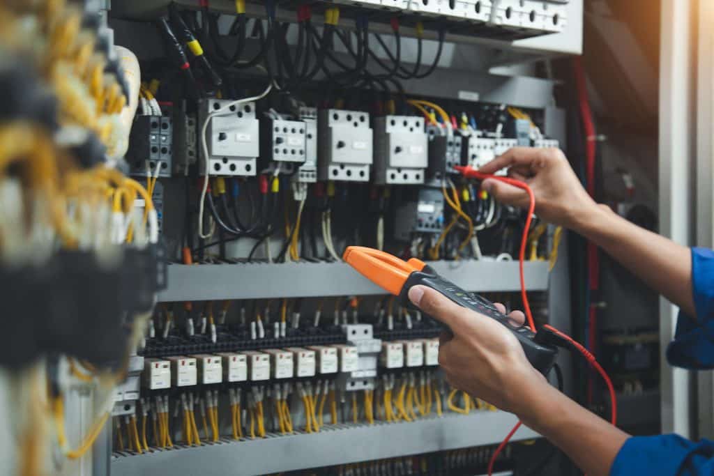 person testing power breakers